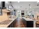 Modern kitchen with granite countertops, stainless steel appliances, and an open floor plan at 4814 Little Cove Ct, Auburn, GA 30011