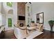 Comfortable living room with stone fireplace, large windows, and hardwood floors at 4814 Little Cove Ct, Auburn, GA 30011