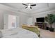 Comfortable main bedroom showing ensuite bathroom, trey ceiling and fireplace at 4814 Little Cove Ct, Auburn, GA 30011