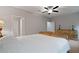 Bright main bedroom with ceiling fan and traditional-style decor, creating a calm, inviting atmosphere at 4814 Little Cove Ct, Auburn, GA 30011