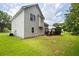 A view of the backyard, highlighting the deck, lawn, and the siding of the home at 1093 Athena Ct, Acworth, GA 30101