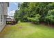 Grassy backyard with mature trees at 1093 Athena Ct, Acworth, GA 30101