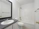 Clean bathroom featuring a vanity, toilet, and shower-tub combo at 1093 Athena Ct, Acworth, GA 30101