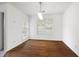 Bright dining room with hardwood floors and a window overlooking the backyard at 1093 Athena Ct, Acworth, GA 30101