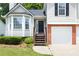 Close up of the front exterior highlighting the entryway and the two-car garage at 1093 Athena Ct, Acworth, GA 30101