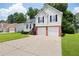 Traditional two-story home with an attached two-car garage and well-manicured lawn at 1093 Athena Ct, Acworth, GA 30101