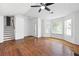 Open-concept living space with hardwood floors, a fireplace, and large windows at 1093 Athena Ct, Acworth, GA 30101