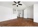 Open-concept living room with hardwood floors, white walls, and a view of the staircase at 1093 Athena Ct, Acworth, GA 30101