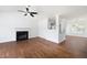 Spacious living room with hardwood floors, a fireplace, and an open layout at 1093 Athena Ct, Acworth, GA 30101