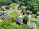 Aerial view of a residential neighborhood surrounded by trees at 5054 Kingsbridge Pass, Powder Springs, GA 30127