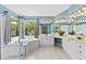 Bright bathroom featuring double vanity, corner tub, with blue walls and tile flooring at 5054 Kingsbridge Pass, Powder Springs, GA 30127