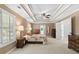 Spacious bedroom featuring tray ceilings, neutral walls, and large windows with natural light at 5054 Kingsbridge Pass, Powder Springs, GA 30127