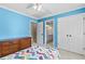 Comfortable bedroom with blue walls and a view to the bathroom at 5054 Kingsbridge Pass, Powder Springs, GA 30127