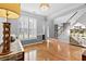 Bright dining room with hardwood floors, stylish chandelier, and ample natural light at 5054 Kingsbridge Pass, Powder Springs, GA 30127