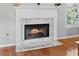 Close up of a fireplace with a marble surround and hearth in a well-lit living space at 5054 Kingsbridge Pass, Powder Springs, GA 30127
