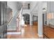 Grand foyer with hardwood floors, staircase, and views into other living spaces at 5054 Kingsbridge Pass, Powder Springs, GA 30127