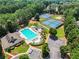 Community amenities feature a large swimming pool, tennis courts, and beautifully landscaped grounds at 5054 Kingsbridge Pass, Powder Springs, GA 30127