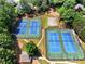 Tennis courts featuring well-maintained courts surrounded by trees at 5054 Kingsbridge Pass, Powder Springs, GA 30127