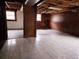 Spacious unfinished basement with tile floor and windows letting in natural light at 7437 Grayson Dr, Riverdale, GA 30296