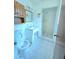 Bathroom with tiled shower, tile floor, toilet, and vanity at 7437 Grayson Dr, Riverdale, GA 30296