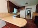 Kitchen with breakfast bar and plenty of cabinet space, leading to the dining area at 7437 Grayson Dr, Riverdale, GA 30296