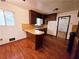 Eat in kitchen with breakfast bar and plenty of cabinet space, leading to the dining area at 7437 Grayson Dr, Riverdale, GA 30296