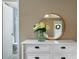 Bathroom vanity with mirror and white flowers at 86 Kelly Ct, Dallas, GA 30157