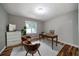 Office with lots of light, wood floor, neutral paint color, desk and comfortable chairs at 86 Kelly Ct, Dallas, GA 30157