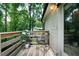Exterior wooden deck with chair and green surroundings at 86 Kelly Ct, Dallas, GA 30157