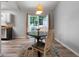 Cozy dining area features hardwood floors, a round table, and sliding glass doors, creating a warm ambiance at 86 Kelly Ct, Dallas, GA 30157