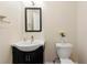 Cozy bathroom features a sleek vanity with vessel sink and a decorative mirror at 1413 Eastbrooke Way, Marietta, GA 30066