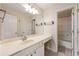 Well-lit bathroom with double sinks, large vanity, and a separate shower at 1413 Eastbrooke Way, Marietta, GA 30066