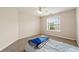 Cozy bedroom with neutral carpet and a window overlooking the neighborhood at 1413 Eastbrooke Way, Marietta, GA 30066