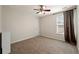 Cozy bedroom with neutral carpet, ceiling fan, and natural light at 1413 Eastbrooke Way, Marietta, GA 30066