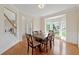 Bright dining room features hardwood floors, a large window, and decorative molding at 1413 Eastbrooke Way, Marietta, GA 30066