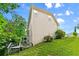 Backyard with tiered deck, and lush greenery against the backdrop of a two-story home at 1413 Eastbrooke Way, Marietta, GA 30066