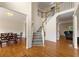 Spacious foyer with hardwood floors, staircase and adjacent dining and living spaces at 1413 Eastbrooke Way, Marietta, GA 30066