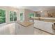 Sun-filled kitchen featuring an island, granite countertops, and ample counter space at 1413 Eastbrooke Way, Marietta, GA 30066