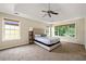Spacious main bedroom with large windows and tray ceiling; a cozy and relaxing retreat at 1413 Eastbrooke Way, Marietta, GA 30066