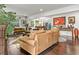 The open living room and dining room boasts hardwood floors, providing seamless transitions for modern living at 3143 Church St, East Point, GA 30344