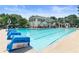 Large community pool with chairs for lounging on a sunny day at 4211 Schooner Ne Ct, Roswell, GA 30075