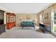 Cozy living room featuring neutral carpet, large windows, and classic furniture at 4211 Schooner Ne Ct, Roswell, GA 30075