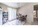 Functional dining area with sliding doors, and an adjacent kitchen area at 504 Azalea Ct, Woodstock, GA 30188