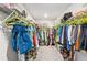 Well-organized walk-in closet featuring rows of shelving, hanging rods, and storage bins for all your clothing at 515 Cobblestone Ct, Canton, GA 30115