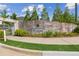 Welcoming brick entrance to the Meadows at Idylwilde community with lush landscaping and signage at 515 Cobblestone Ct, Canton, GA 30115