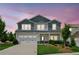 Beautiful two-story home showcasing attractive curb appeal with a well-maintained lawn and driveway at 515 Cobblestone Ct, Canton, GA 30115