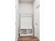 A mud room features a storage bench with hooks and cubbies at 515 Cobblestone Ct, Canton, GA 30115