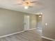 Neutral living space showcasing wood-look floors, neutral paint, ceiling fan and recessed lighting at 7400 Little Fawn Pkwy, Palmetto, GA 30268