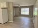 Bright living area with neutral walls, modern flooring, and natural light streaming through the window at 7400 Little Fawn Pkwy, Palmetto, GA 30268
