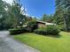 Well maintained, one-story home with lush hedges and green lawn, creating privacy at 1534 Cooper Lake Se Rd, Smyrna, GA 30082